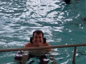 man swimming in pool