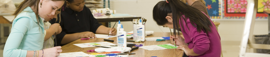 elementary school students doing table craft