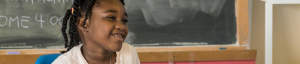 young student smiling in class