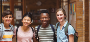 Teens smiling with new friends made through the PEERS® Program for Teens